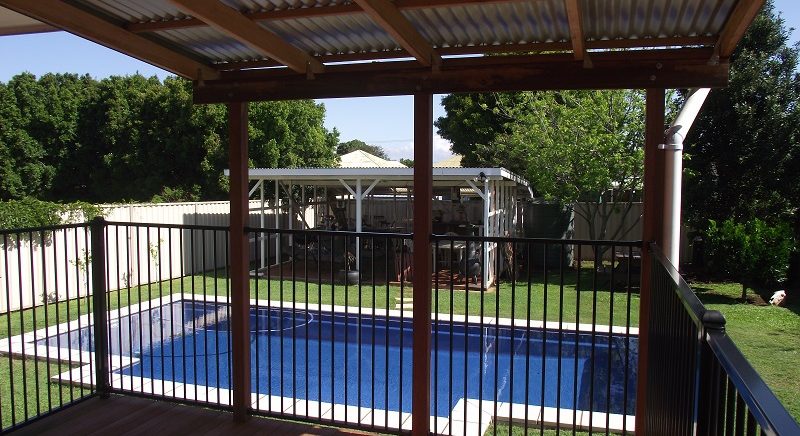 Pool deck with fencing